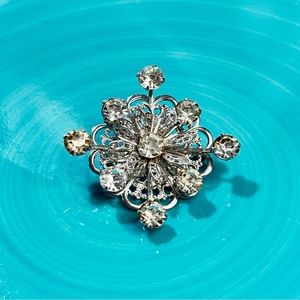 Silver tone rhinestone brooch